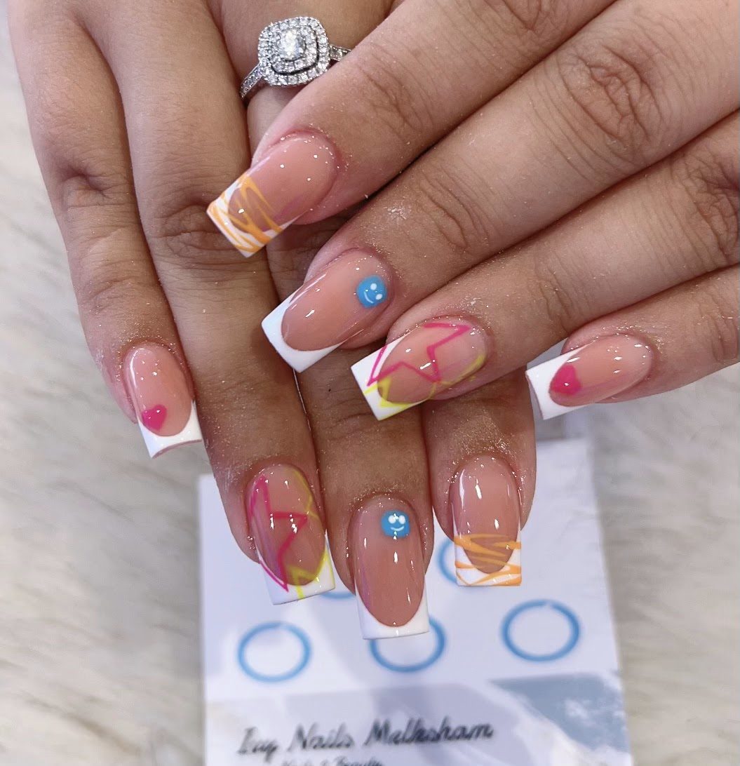 French tips with neon line art and gems, held over an Ivy Nails stamp card